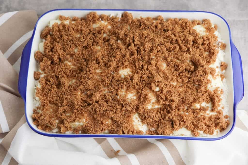 Cinnamon roll dump cake in baking dish, ready to go into the oven.