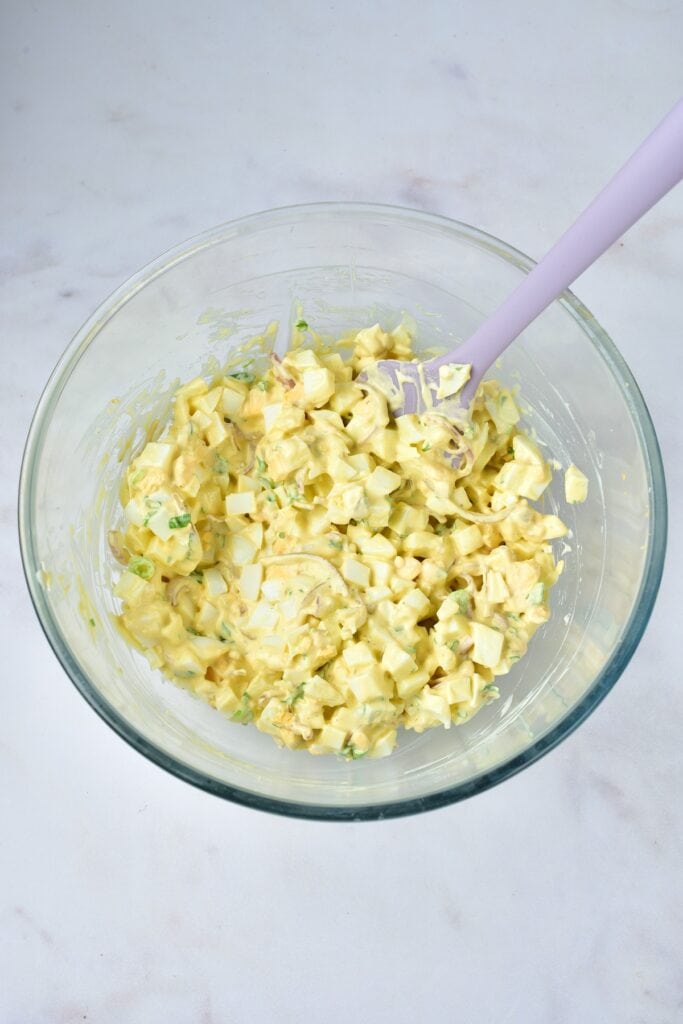 Overhead shot of egg salad in mixing bowl.