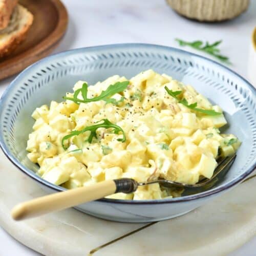 Egg salad in blue serving bowl.