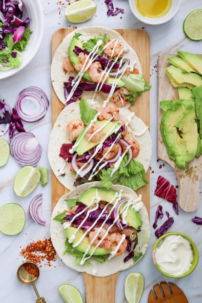 Spicy Shrimp Tacos on serving board, overhead shot.