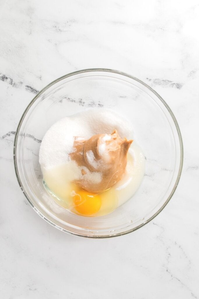 3 Ingredient Peanut Butter Cookies ingredients in glass bowl, overhead shot.