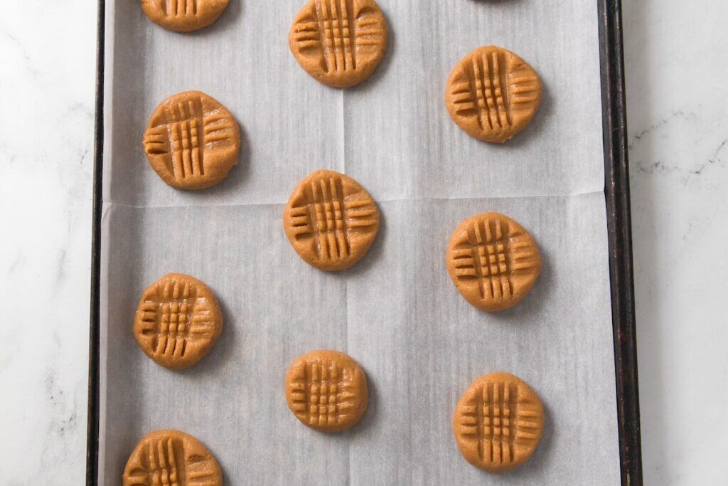 3 Ingredient Peanut Butter Cookies on baking tray, ready to cook.