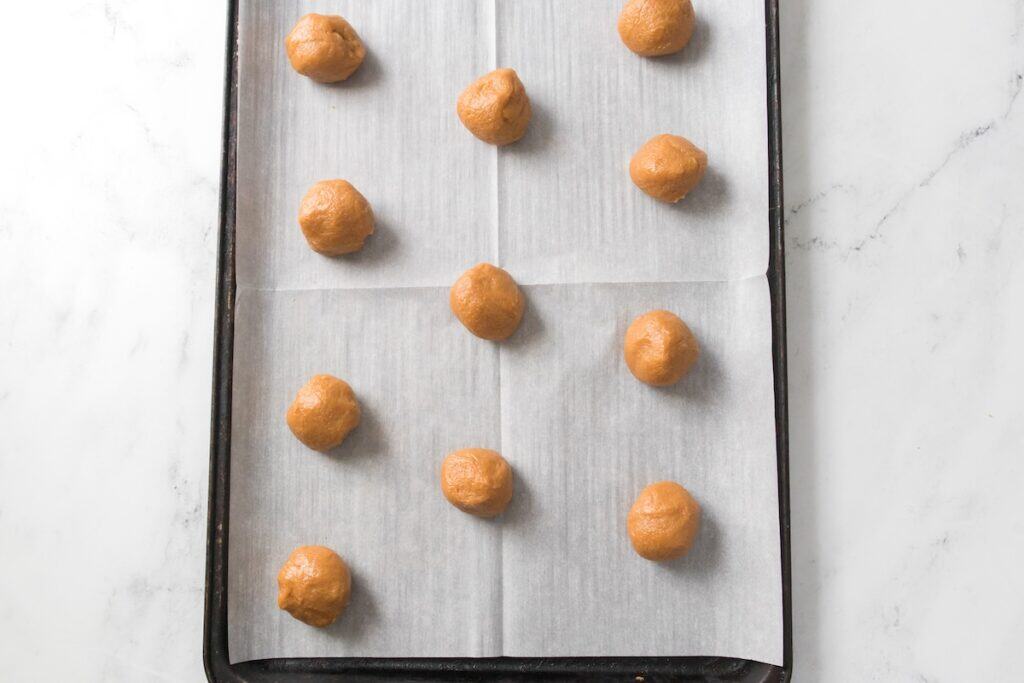 3 Ingredient Peanut Butter Cookies on baking tray, rolled.
