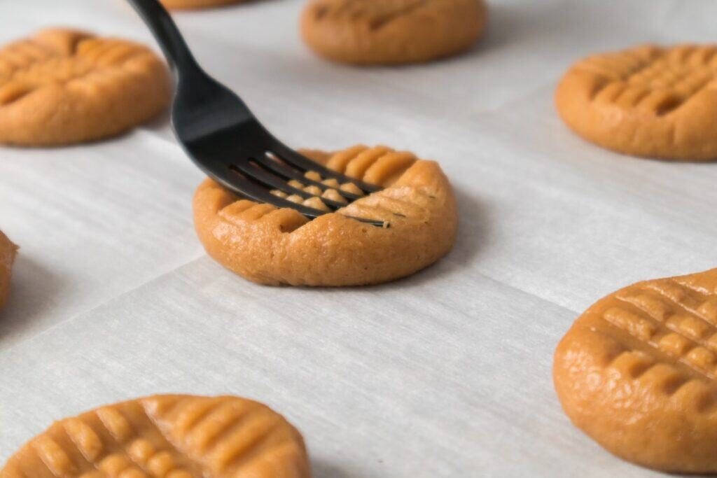 3 Ingredient Peanut Butter Cookies on baking tray with fork.