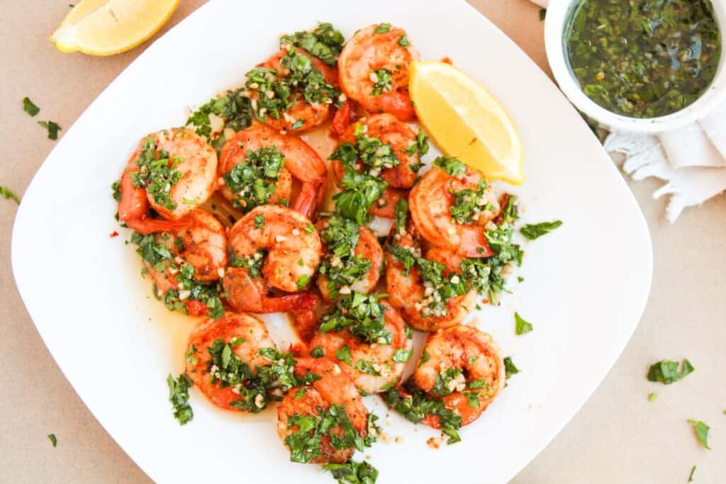 Chimichurri Shrimp on white plate, overhead shot.