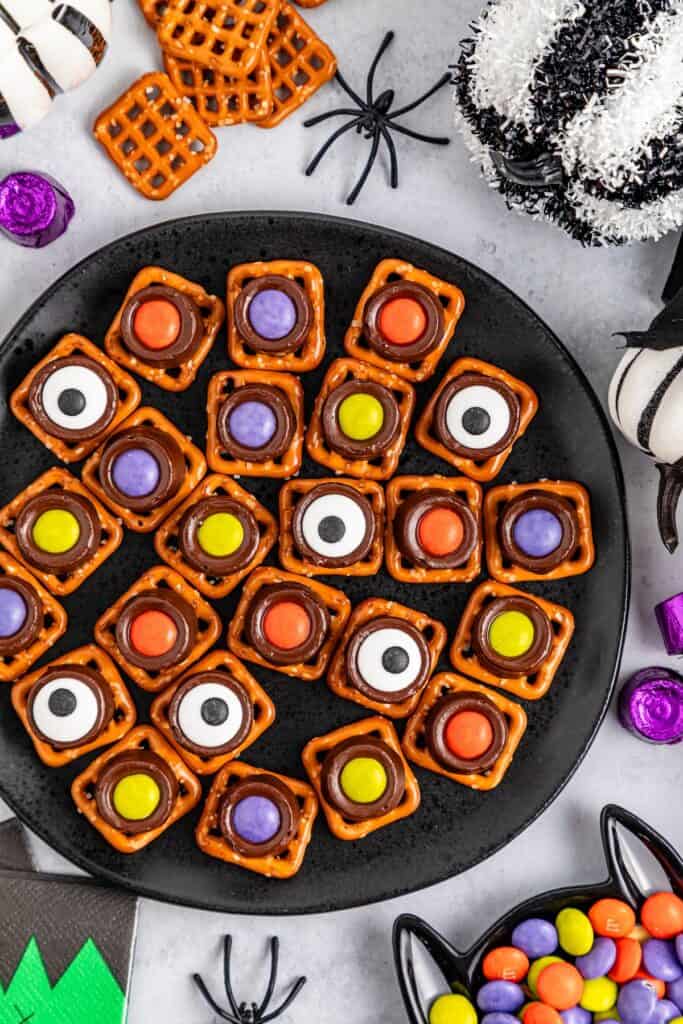 Halloween Rolo Pretzels on black serving tray.