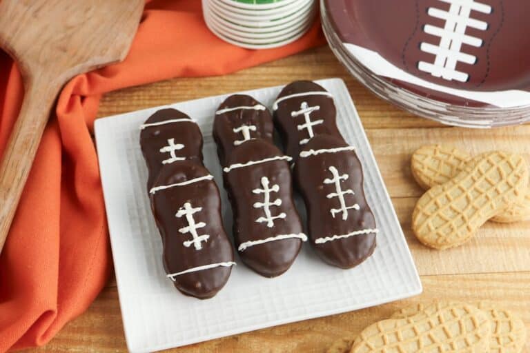 Nutter Butter Football Cookies on white plate.