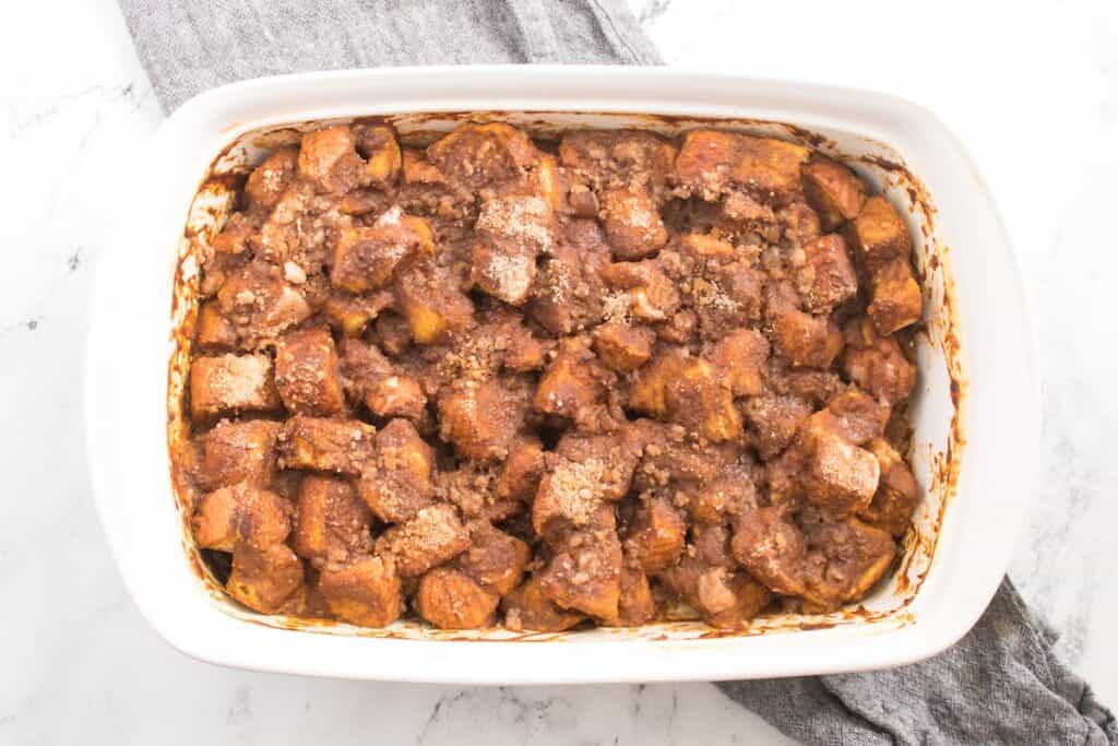 Pumpkin French Toast Bake in white serving dish.