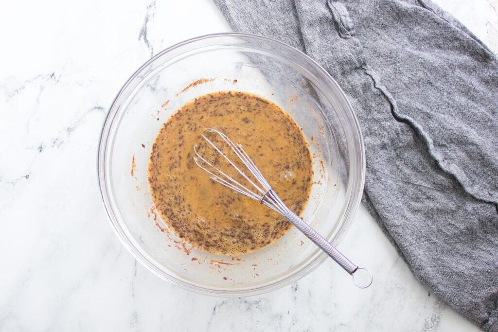 Pumpkin French Toast Bake, in process, batter ingredients whisked in glass bowl.