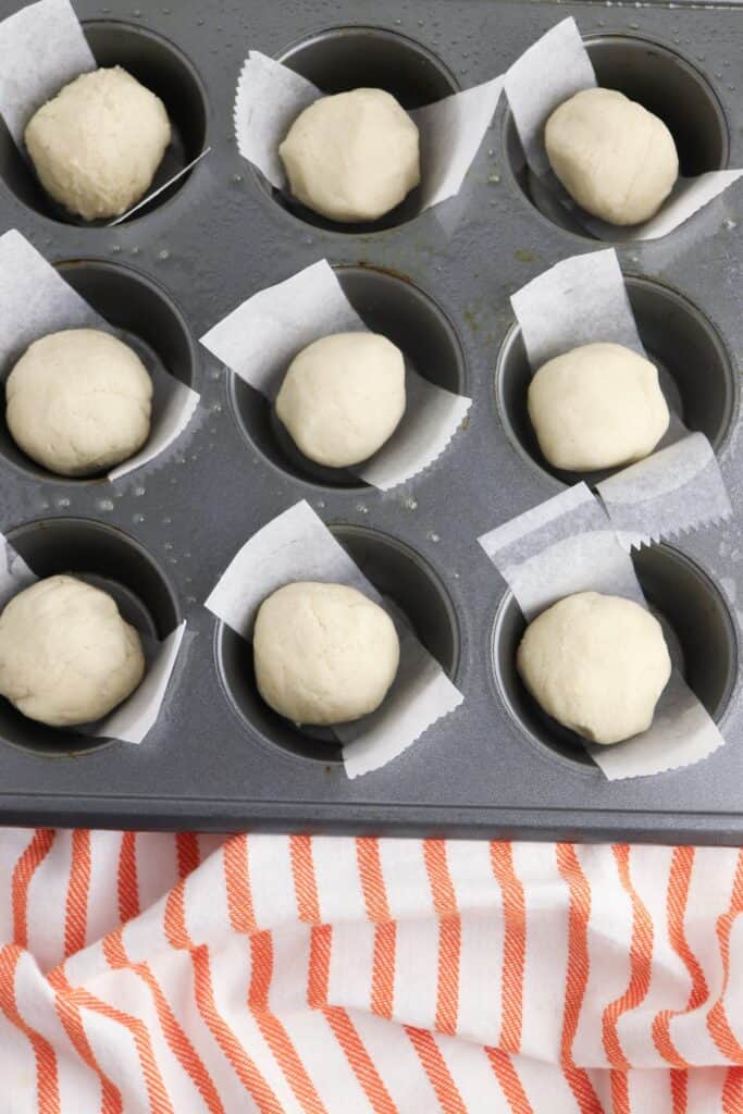 Pumpkin Pie Sugar Cookies, in process, cookie dough in parchment lined muffin pan.