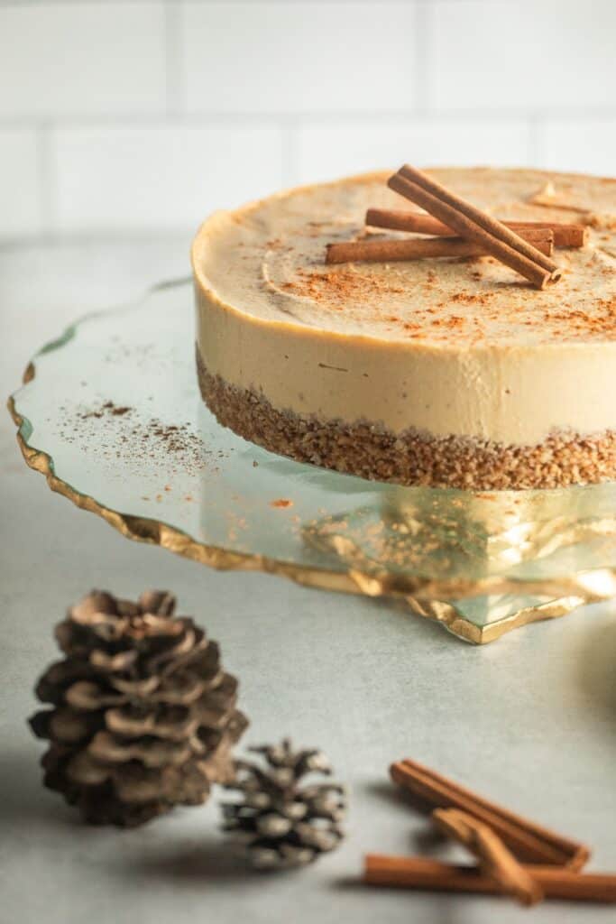 Pumpkin Spice Cheesecake on glass serving stand.
