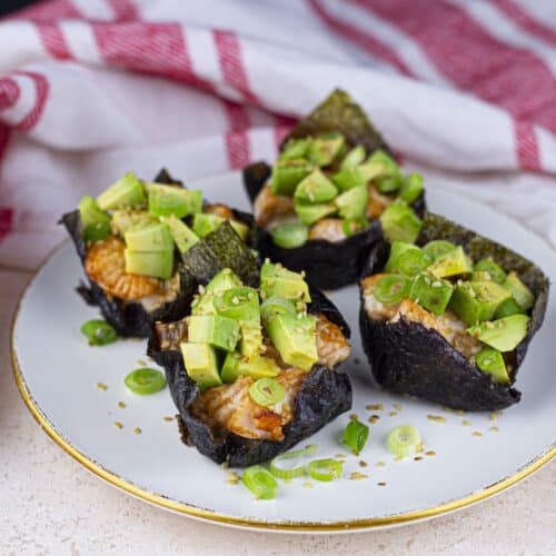 Baked Salmon Sushi Cups, plated, with red striped kitchen towel.