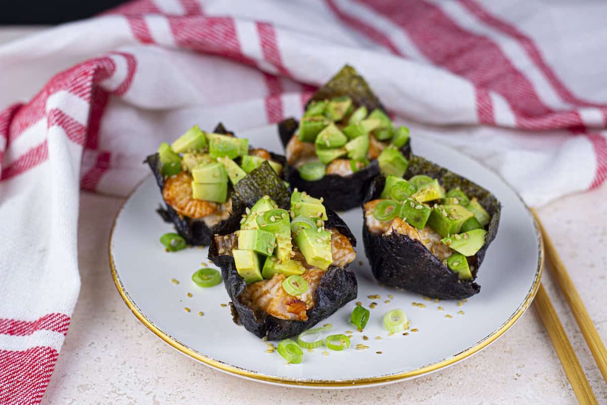 Baked Salmon Sushi Cups, plated, with red striped kitchen towel.