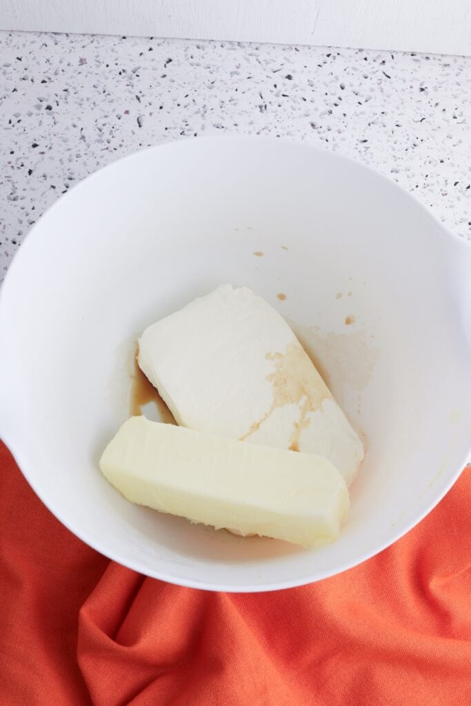 Mini Cream Cheese Pumpkin Cakes, cream cheese filling, in process, butter, cream cheese, vanilla, in bowl.