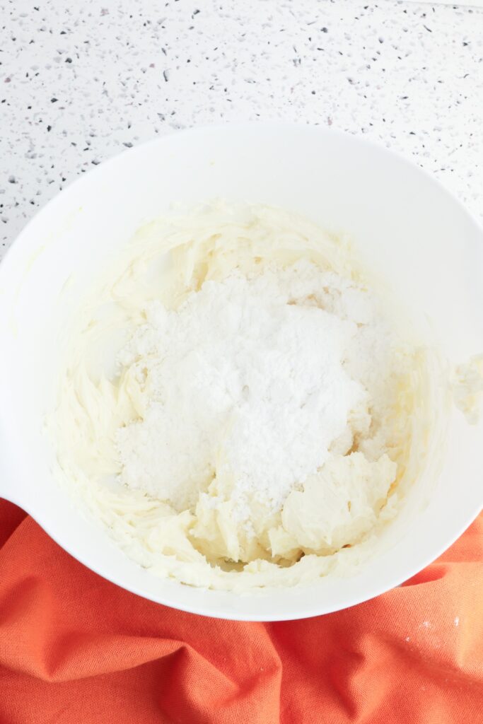Mini Cream Cheese Pumpkin Cakes, cream cheese filling, in process, butter, cream cheese, vanilla, mixed in bowl.
