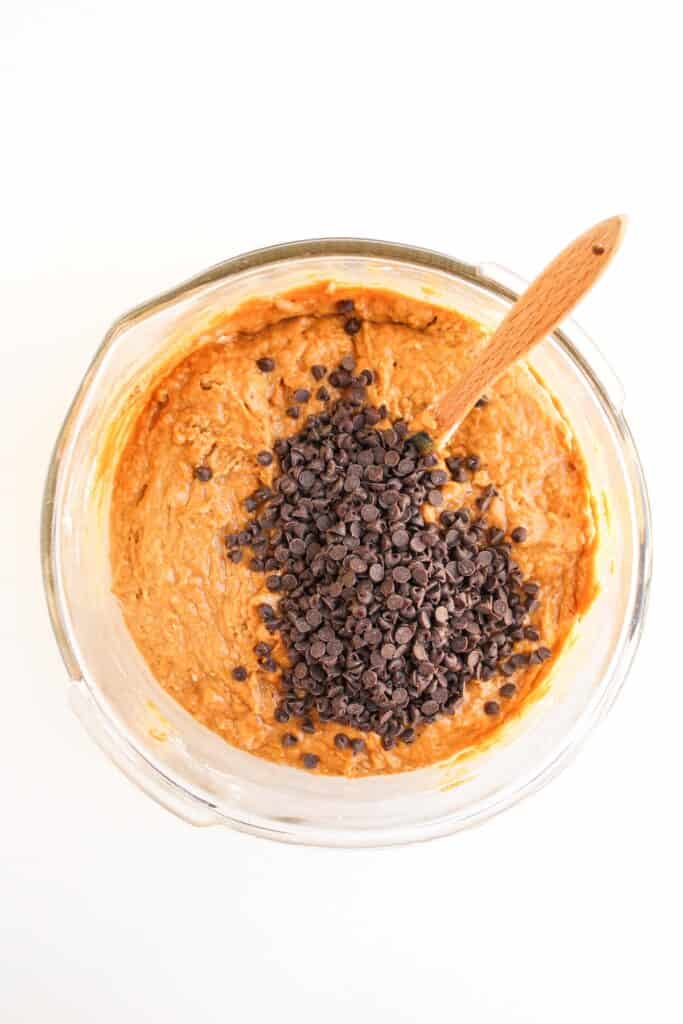Pumpkin Chocolate Chip Muffins, in process, dark chocolate chips added to batter.