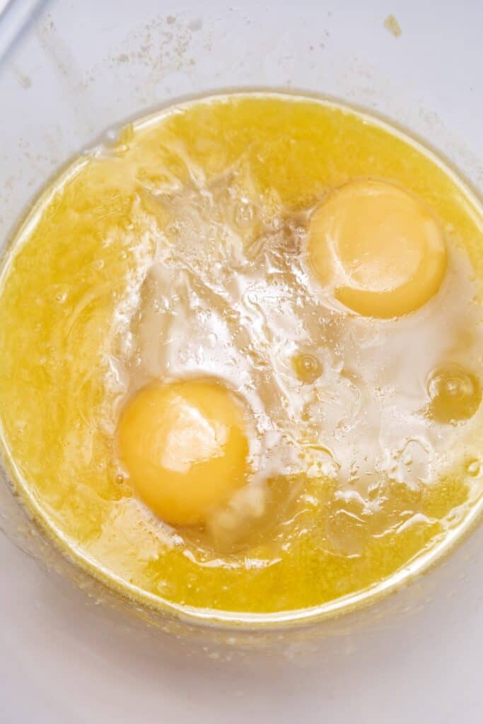Pumpkin Cinnamon Rolls in process, eggs added to batter.
