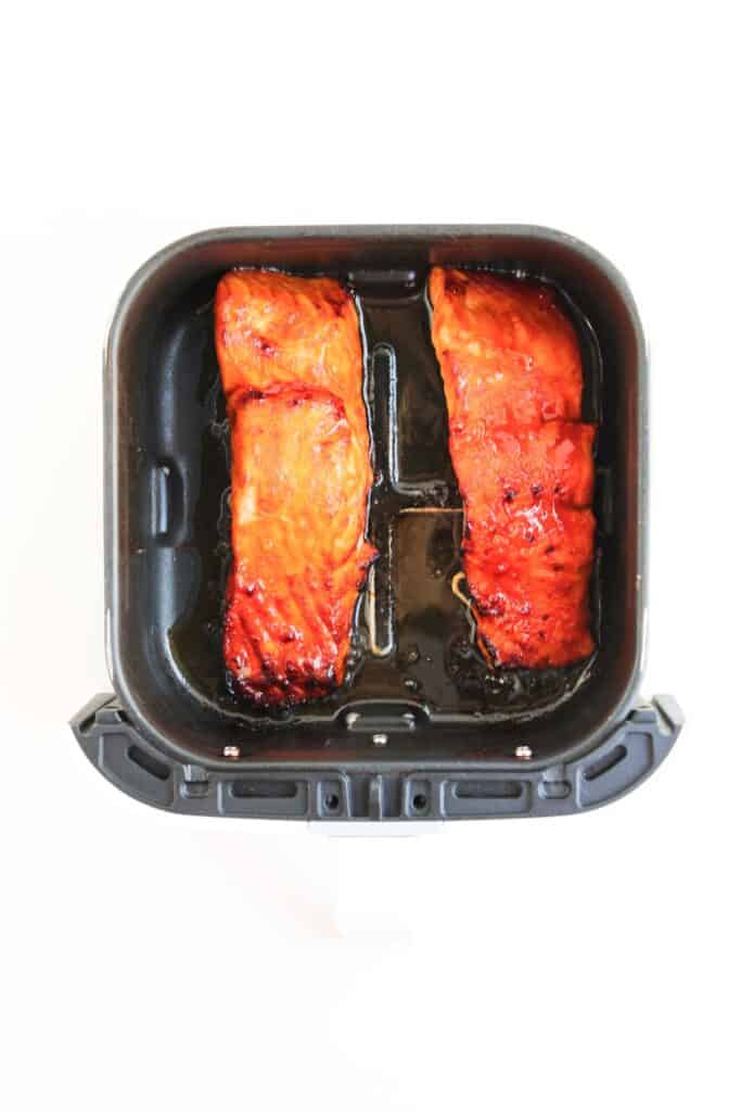 Spicy Salmon Bowl, in process, cooked salmon in air fryer dish.