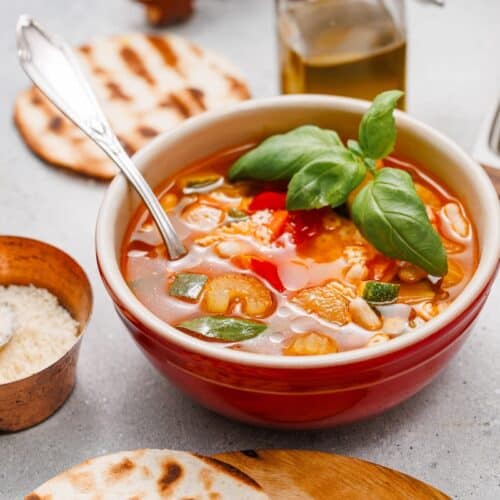 Veggie Minestrone Soup in bowl with spoon.