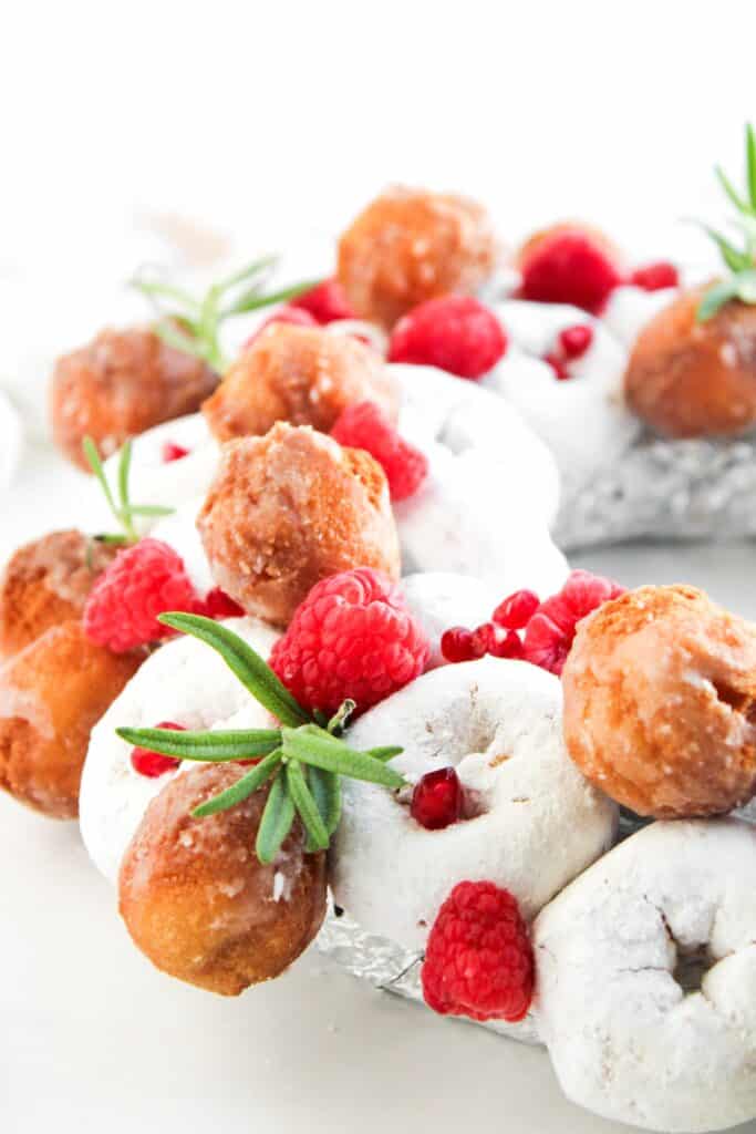Piece of Christmas Donut Wreath on white background.