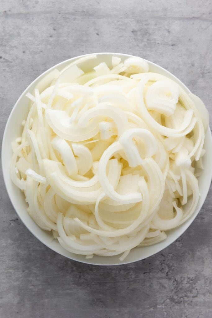 French Onion Soup, in process, chopped onions in bowl.