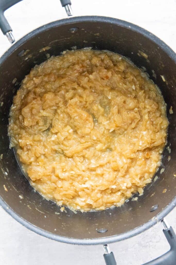 French Onion Soup, in process, chopped onions deglazed with white wine in pot.