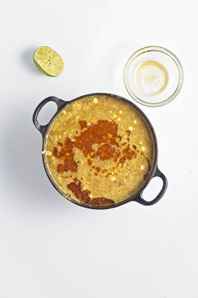 Miso Corn Soup, in process, adding sesame oil and lime juice to soup.