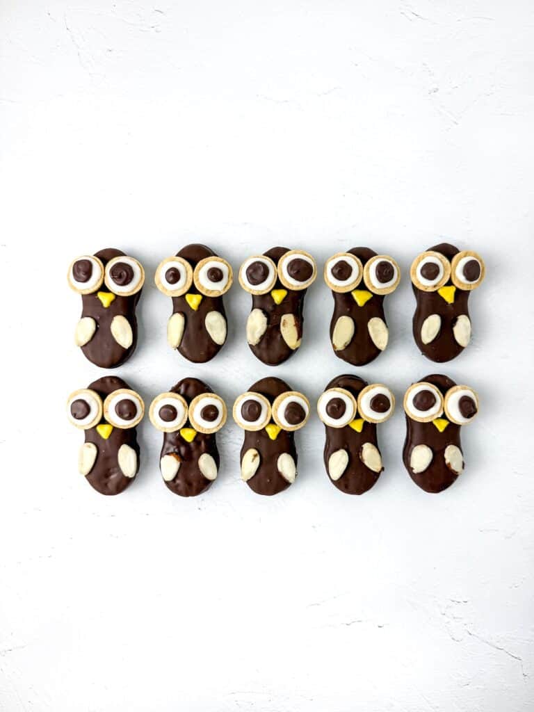 Nutter Butter Owl Cookies, in process, completed Nutter Butter owls in two rows of five.