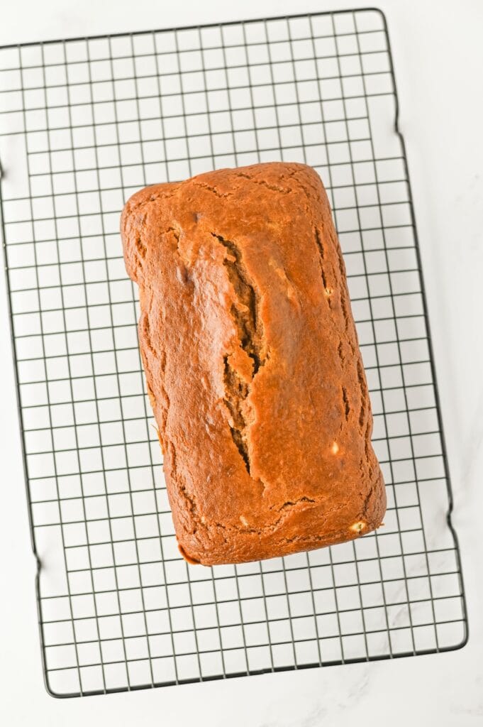 Pumpkin Cream Cheese Bread, in process, loaf on cooling rack.