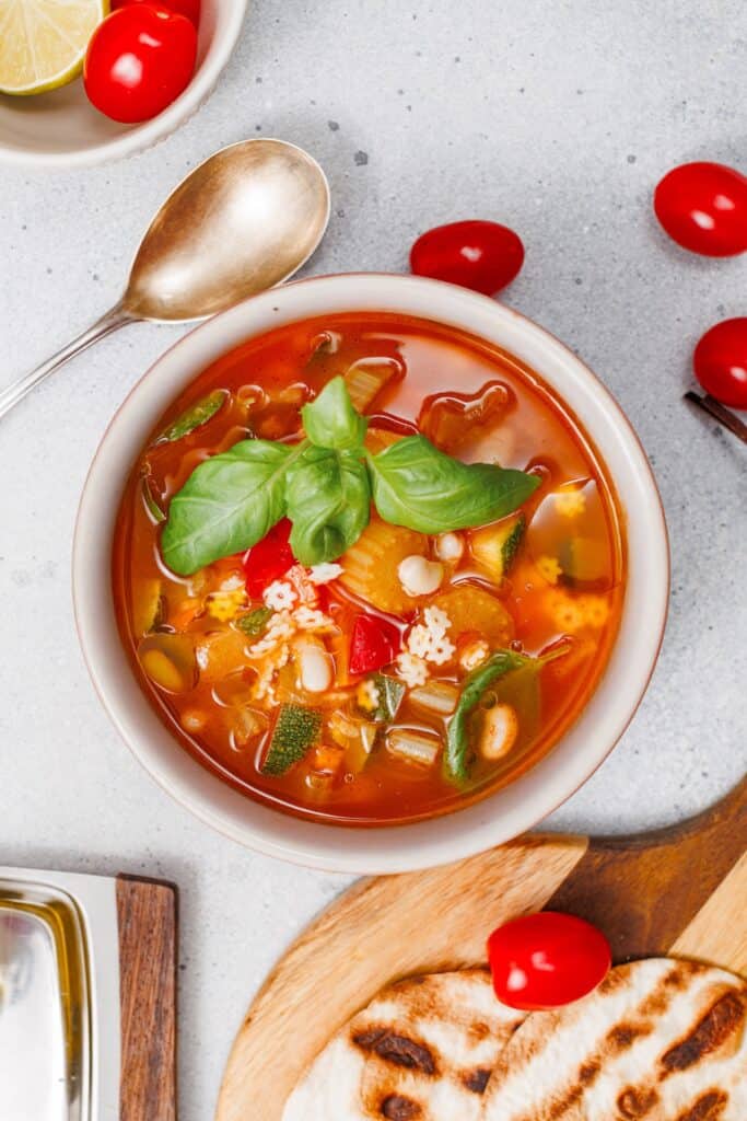 Veggie Minestrone Soup, overhead shot with spoon.