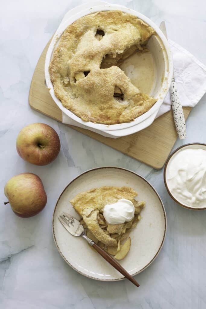 Double-Crust Honeycrisp Apple Pie and piece on plate, overhead shot.