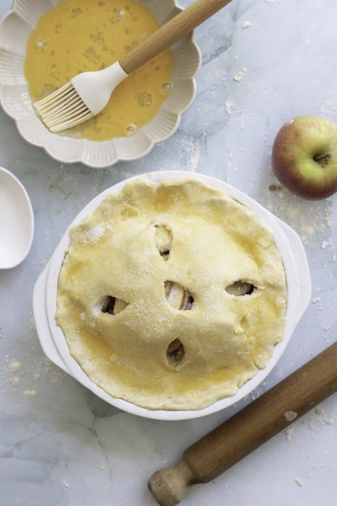 Double-Crust Honeycrisp Apple Pie, in process, egg wash added to dough topping.