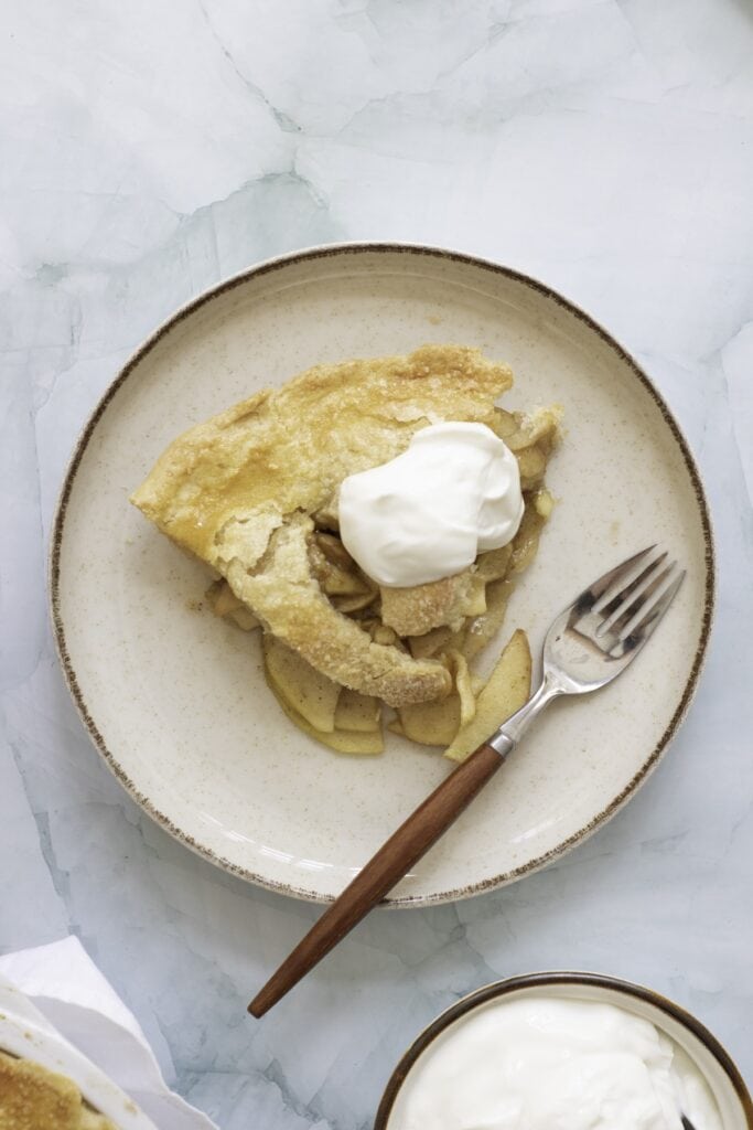 Double-Crust Honeycrisp Apple Pie, piece of pie with fork on plate, overhead.